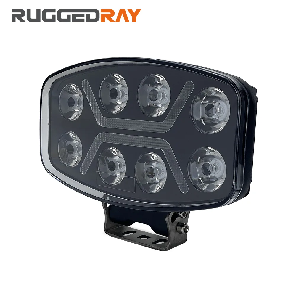 RuggedRay TC-Q90C LED driving light shown three-quarter on, eight projector lenses in two rows of four with a light strip between them and a mounting bracket below
