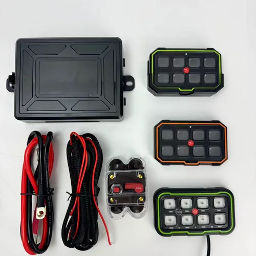 TC-SW8W kit laid out: control box, switch panels in green and orange finish, battery leads and 60A breaker